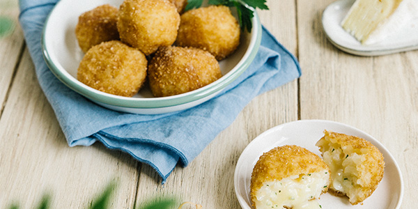 Image de cover représentant la page "Mini arancini with Isigny Sainte-Mère Pont l’Évêque" de la société d'Isigny-Sainte-Mère